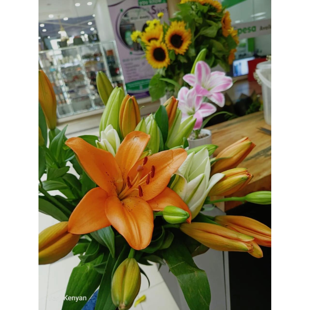 Weekly surprise flower arrangement with an artisan treat from the Very Kenyan Bloom Club